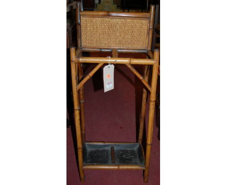 An early 20th century stained bamboo twin division stick-stand