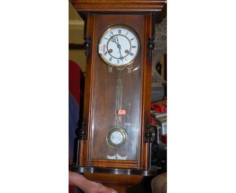 An early 20th century Vienna style drop trunk wall clock