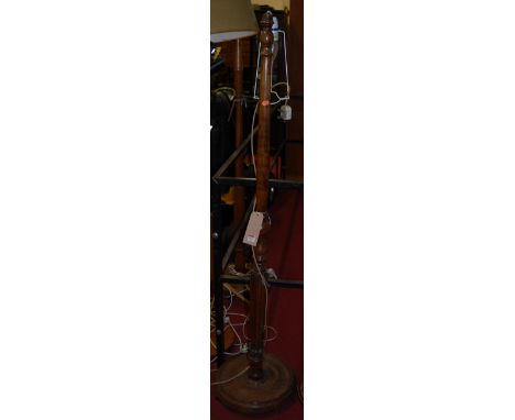 A walnut turned and reeded standard lamp