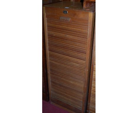 A 1930s light oak tambour fronted office filing cabinet, height 117cm Condition Report / Extra Information Light surface scra