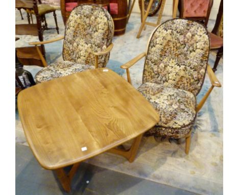 Pair of Ercol armchairs, elastic springs damaged, and an Ercol coffee table 