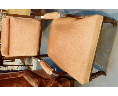 Upholstered nursing chair with turned legs and ceramic castors 