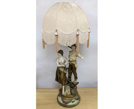 After L &amp; F Moreau - a painted spelter figural table lamp, peasant girl and boy, 96 cms high including shade.