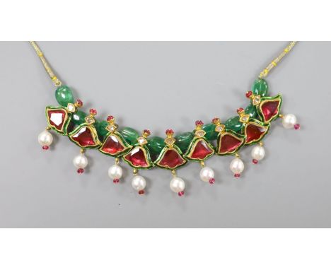 An Indian? emerald, garnet, ruby, enamel and cultured pearl set drop necklace, with fabric chain, overall approx. 68cm.