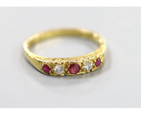 A modern 18ct gold, two stone diamond and three stone ruby half hoop ring, size O, gross weight 3.8 grams.