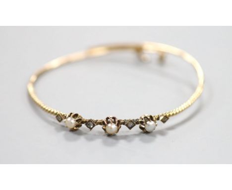 An antique yellow metal, rose cut diamond and pearl(untested) set bangle, gross weight 6.5 grams.