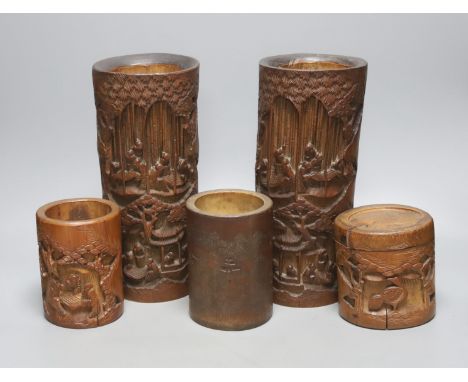 Four Chinese bamboo brushpots and a caddy, tallest brush pot 29 cms high.