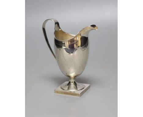 A George III engraved silver helmet shaped cream jug, Andrew Fogelburg, London, 1796, (a.f.), 13.5cm, 120 grams.