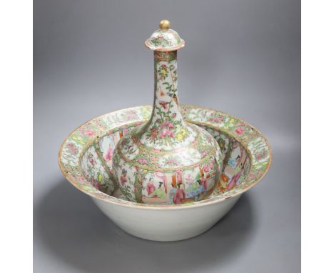 A 19th century Chinese famille rose water bottle with cover and basin, water bottle and cover 39 cms high.