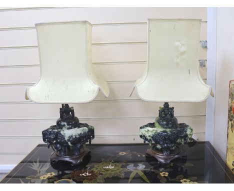A pair of mid 20th century Chinese hardstone tripod censers on lamp stands, including stand 30 cms high.