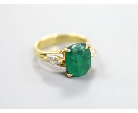 A yellow metal, emerald and diamond three stone ring, size M, gross weight 5.3 grams.