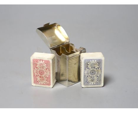 A late Victorian silver playing card case, containing two later? packs of playing cards, Henry Stuart Brown, London, 1899, 47