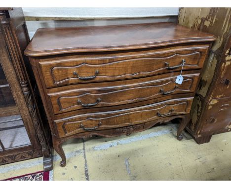 A Louis XV style walnut commode, fitted three long drawers. W-100cm, D-51cm, H-84cm.
