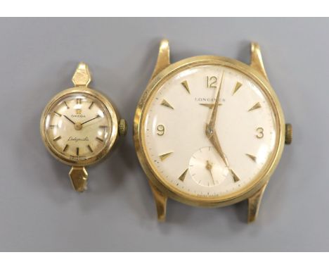 A gentleman's 9ct gold watch Longines manual wind wrist watch (no strap) and a lady's yellow metal Omega Ladymatic wrist watc