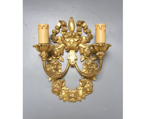 Two pairs of 18th century style Italian giltwood two branch wall lights and one other wall light, 62 cms high.