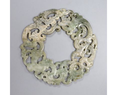 A Chinese archaistic celadon jade disc, D. 23.2cm