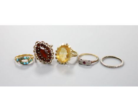 Three assorted 9ct gold and gem set rings including garnet and citrine, gross 11.4 grams, a yellow metal and turquoise ring, 