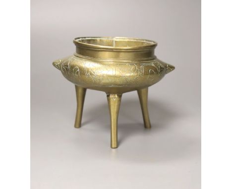 A Chinese brass tripod censer and cover, Xuande mark, 12 cms high.