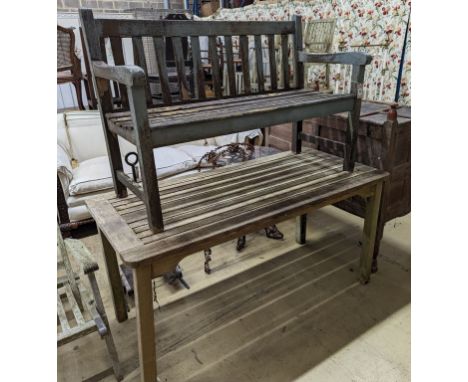 A weathered teak garden bench and rectangular table. Bench - W-122cm, D-54cm, H-83cm. Table - W-149cm, D-70cm, H-74cm.