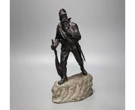 A WW1 period bronze figure of an Austrian soldier, 30 cms high including stone base.