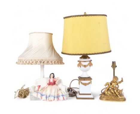 A German Katshutte table lamp, with a figure of a lady seated on a sofa, H46cm overall, a composition cherub lamp, and a Clas