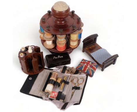 A Vintage mahogany sewing bobbin, with a number of associated threads, varying colours, a second Bakelite Vintage sewing bobb