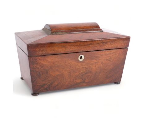 A Regency rosewood tea caddy of sarcophagus form, on bun feet, with fitted inner lids and mixing bowl, W30cm 
