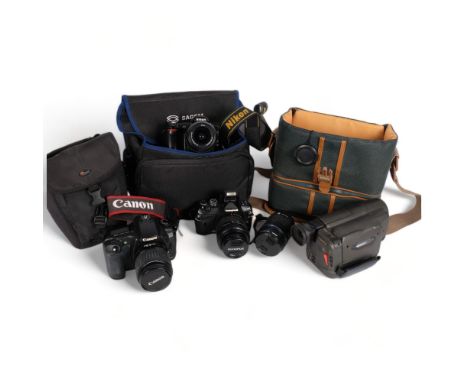 A quantity of Vintage cameras and associated accessories, including a Canon EOS20D, a Nikon D50, an Olympus E-400, a Sanyo Hi