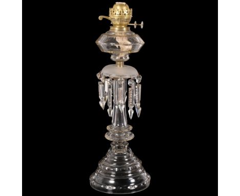 An Antique oak oil lamp, with panelled glass font and arrowhead lustre drops, H56cmLamp is in good overall condition, there i