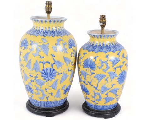 2 similar large ceramic vases, with blue and yellow Oriental decoration, ebonised wooden bases, both vases have been converte