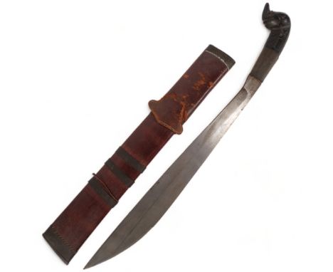 A Philippine machete, with carved animal handle with a leather and bamboo scabbard, blade length 45cm, overall 58cm 