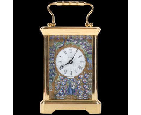 A Halcyon Days brass carriage clock, with white enamelled and coloured enamel panels decorated with peacocks, height not incl