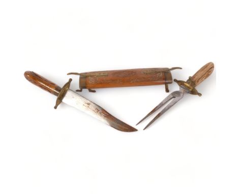 An Indian carved wood cased carving knife and fork set, with brass mounts, L45cm 