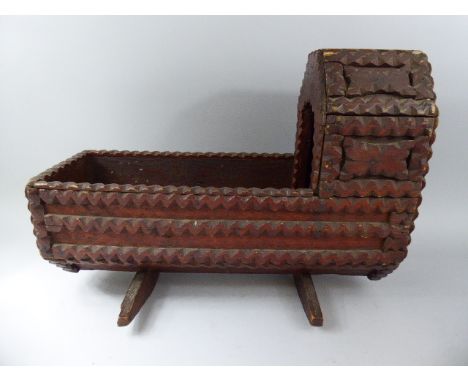 A 19th Century Tramp Art Carved Wood Dolls Cradle. 50cm Long