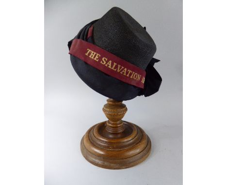An Early 20th Century Ladies Salvation Army Bonnet, Supported on a Turned Ashwood Stand. 38cm High