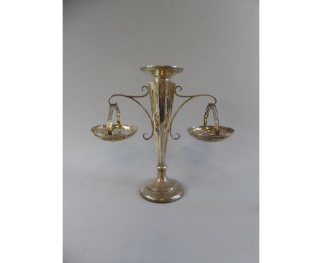 A Weighted Silver Epergne Basewith Circular Foot Leading to Octagonal Fluted Stem, with Scrolling Outspread Handles Supportin