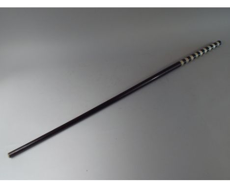 A 19th Century Walking Stick with Ebony Shaft and a Handle Made from Alternate Bands of Black and White Marble. 90cm Long