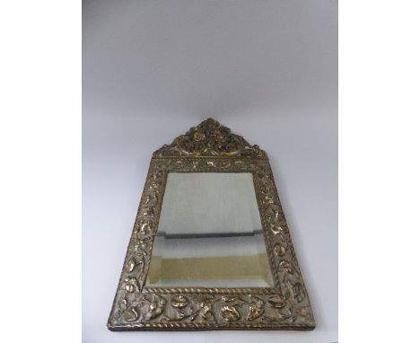 A 19th Century Dutch Brass Repousse Wall Mirror. 22x43cm