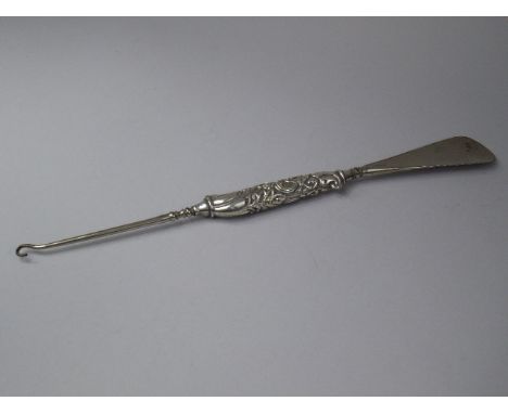 A Silver Handled Button Hook and Shoe Horn, Decorated with Ferns and Leaves in Relief.