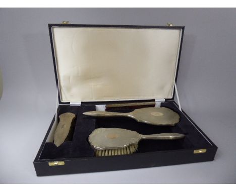 A Cased, Filled Silver, Vanity Set Comprising Two Bushes and Mirror