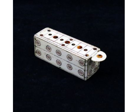 An early 19th century French Napoleonic prisoner of war work carved bone domino set. Of simple rectangular form, with a slide