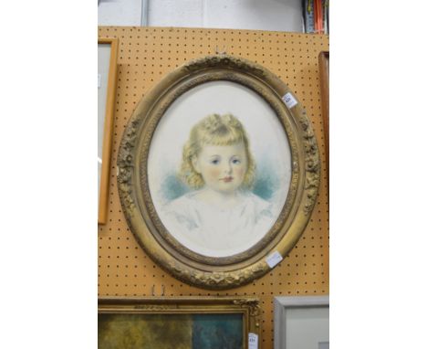 An oval portrait of a young girl watercolour, in a decorative gilt frame.