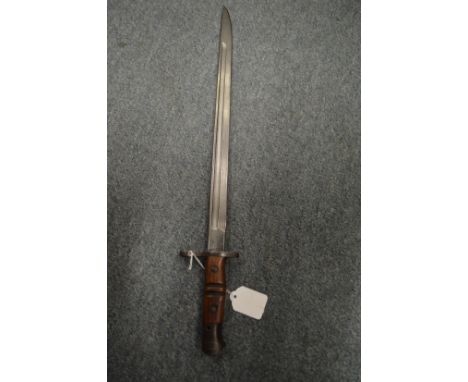 A bayonet with leather covered scabbard, a leather swagger stick and the nose of shell / projectile.