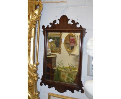 A Georgian style mahogany framed fretwork wall mirror.