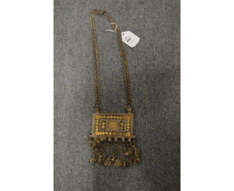 An eastern white metal rectangular large pendant and chain.