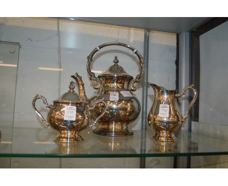 A plated three piece tea service.