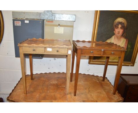 A pair of mahogany two drawer lamp tables.