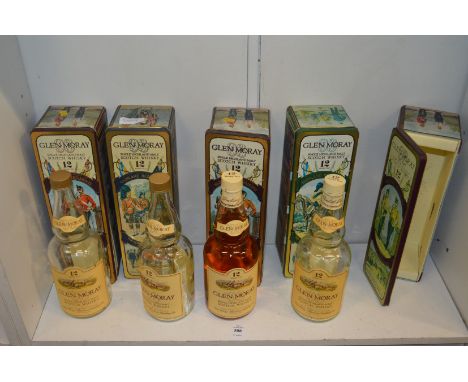 Glen Moray, twelve year old Highland Malt Scotch Whisky in a regimental tin together with similar items (sadly only one compl