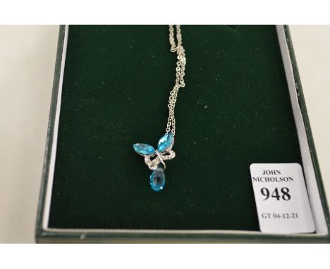 A decorative pendant and chain.