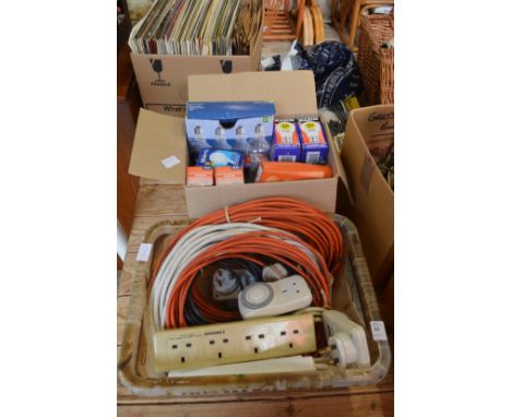 A box of extension cables and a box of light bulbs.